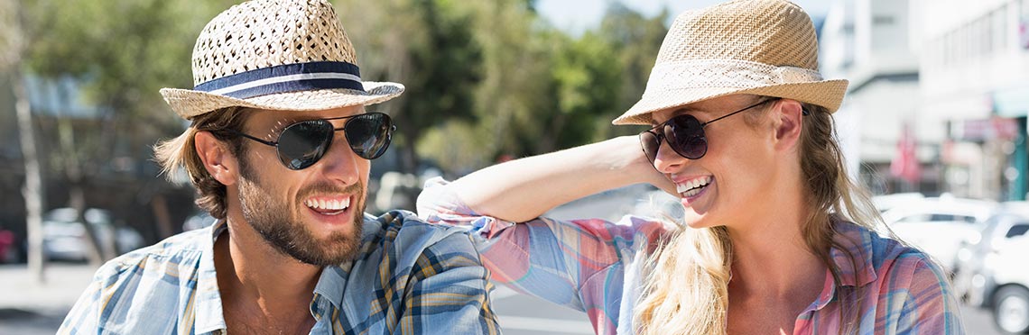 Man and woman wearing sunglasses