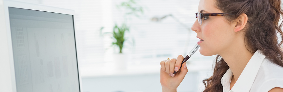 Woman sitting in front of computer screen