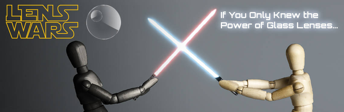 Lens Wars image. Two wooden figures have a lightsaber duel