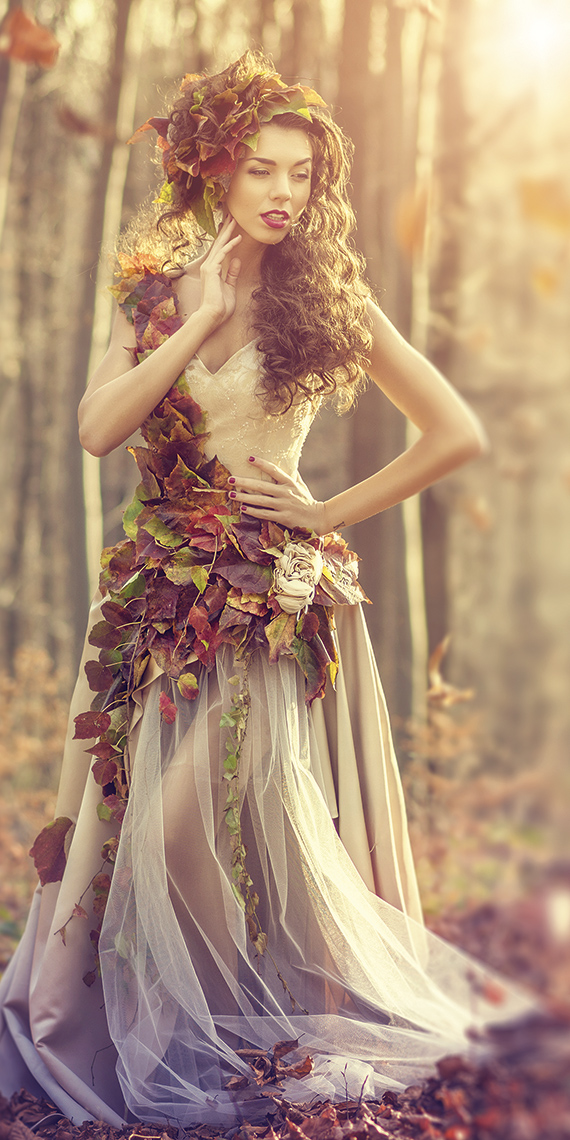 Image of a woman in the woods with autumn dressings