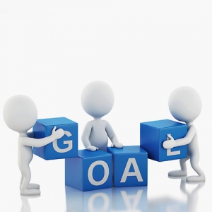 Picture of generic characters holding and assembling blocks with letters on the that spell the word 'goal'