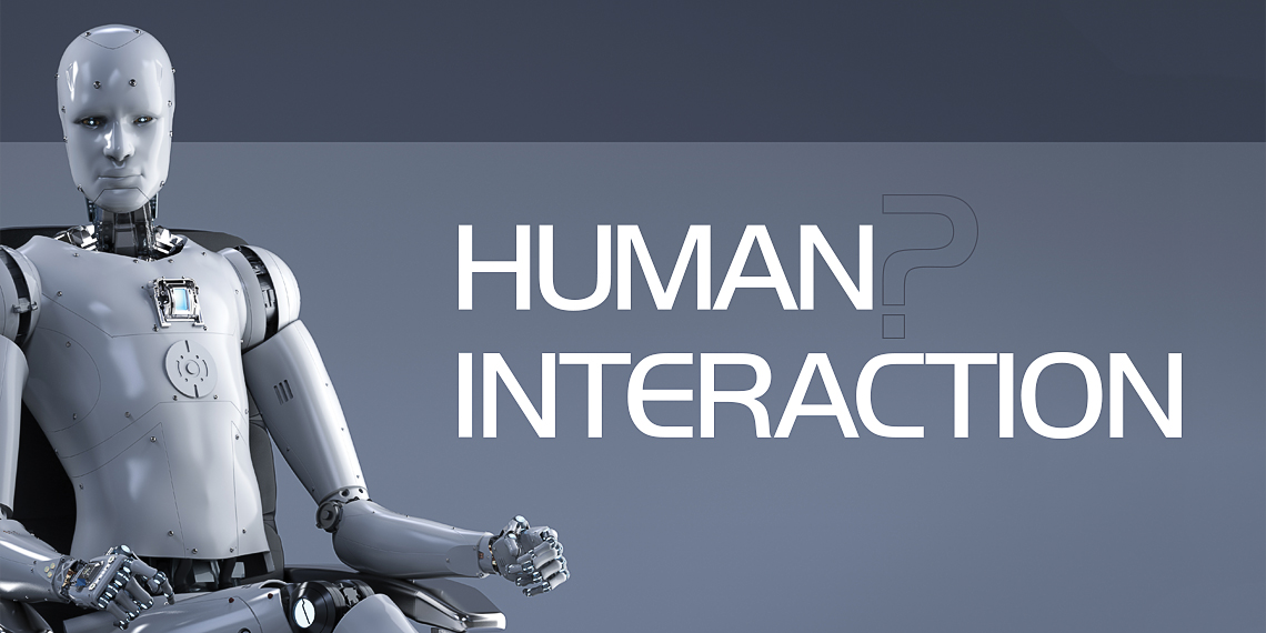 Hero image for article "Human? Interaction". A robot sitting in a chair looking straight ahead.